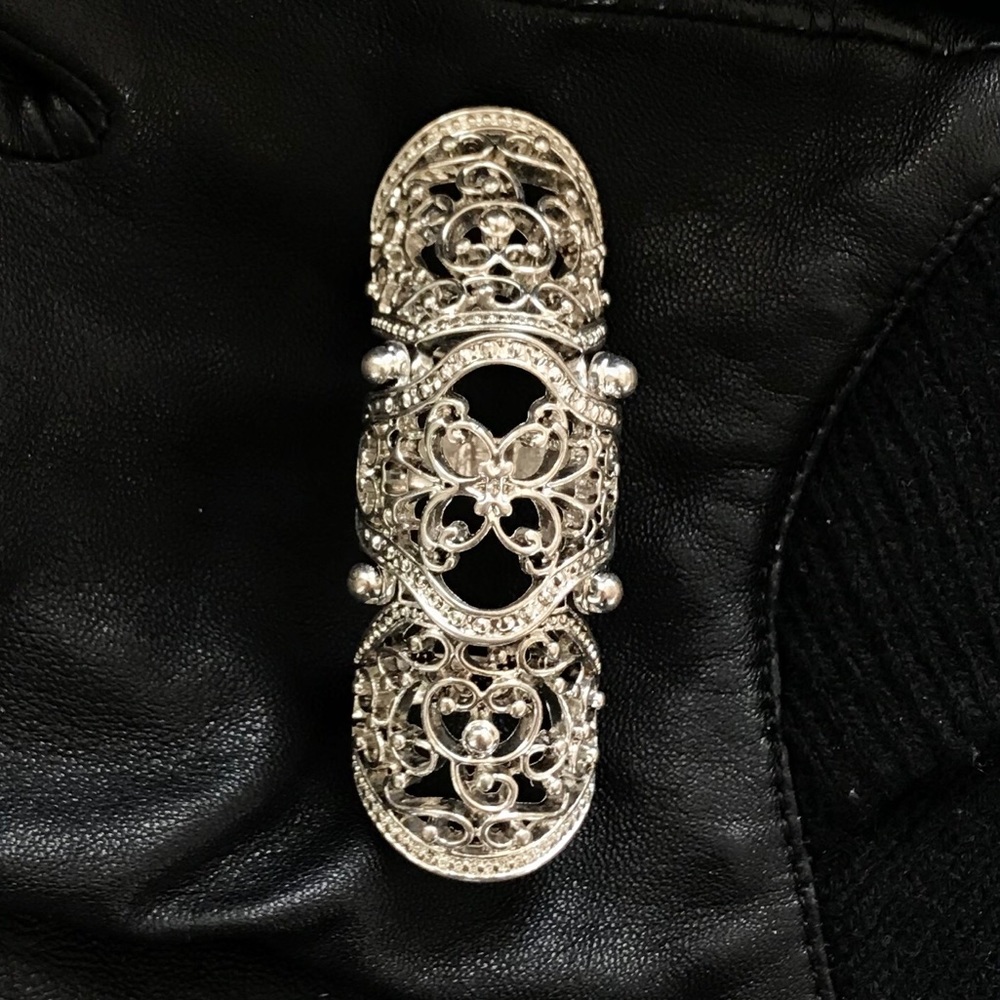 Full finger silver colored ring. NWT